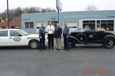 Old and New Ford Patrol Cars