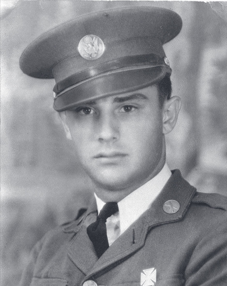 Black-and-white portrait of a young man in military uniform and peaked cap with insignia.