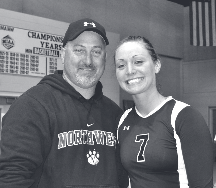 Tpr. Guthrie stands in a gymnasium with a young woman wearing a number 7 volleyball jersey.